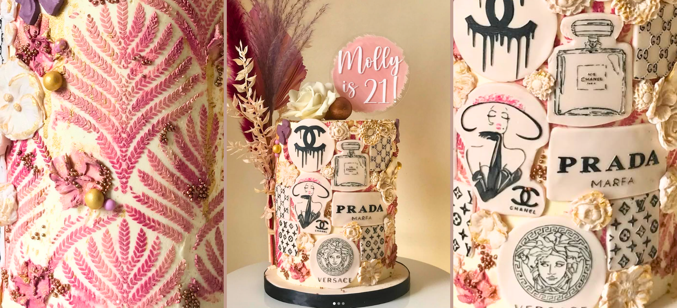 Decorative cake with Prada branding and floral elements on a white surface.