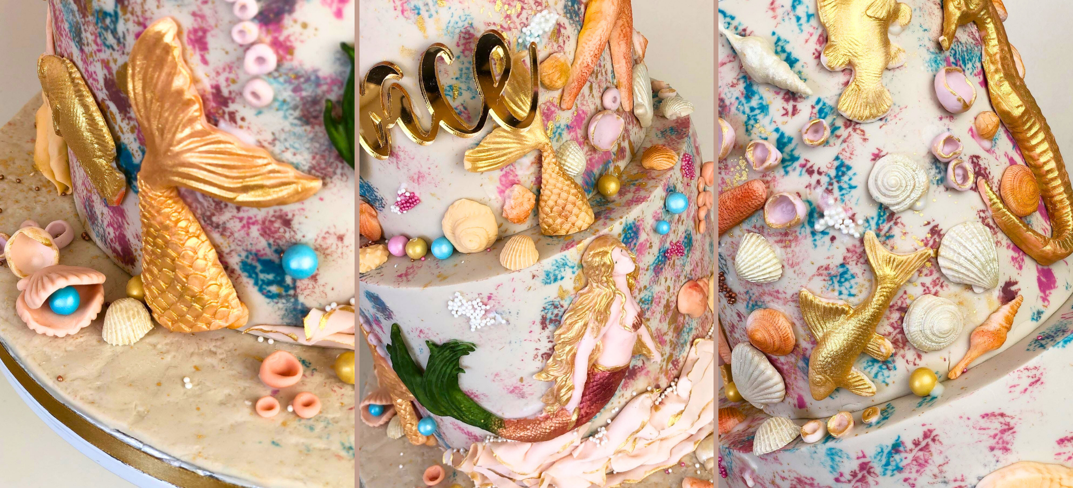 Decorative cake with mermaid-themed decorations including gold mermaid figures, shells, and colorful details.