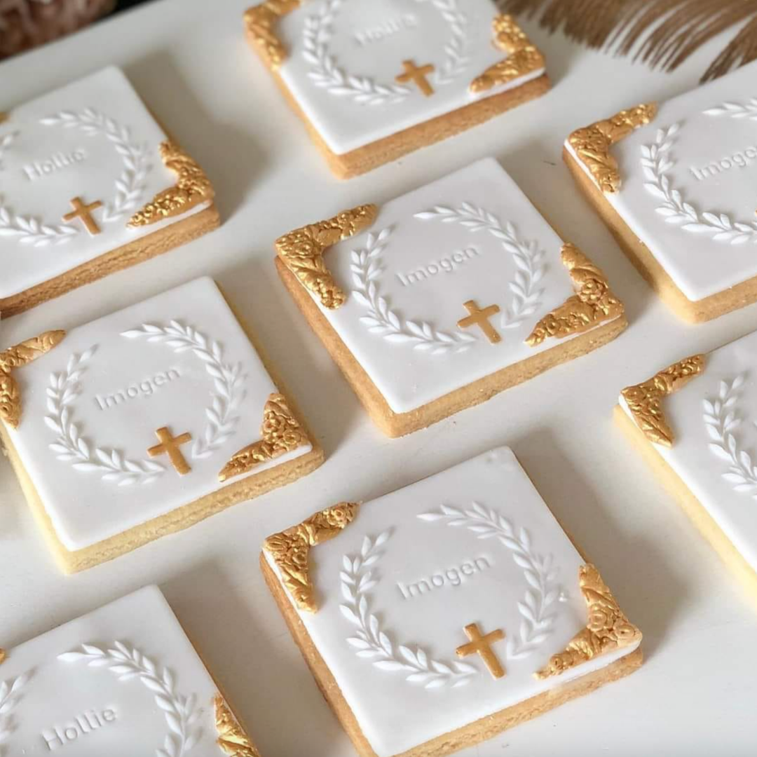 Custom white and gold decorated christening biscuits with personalised names
